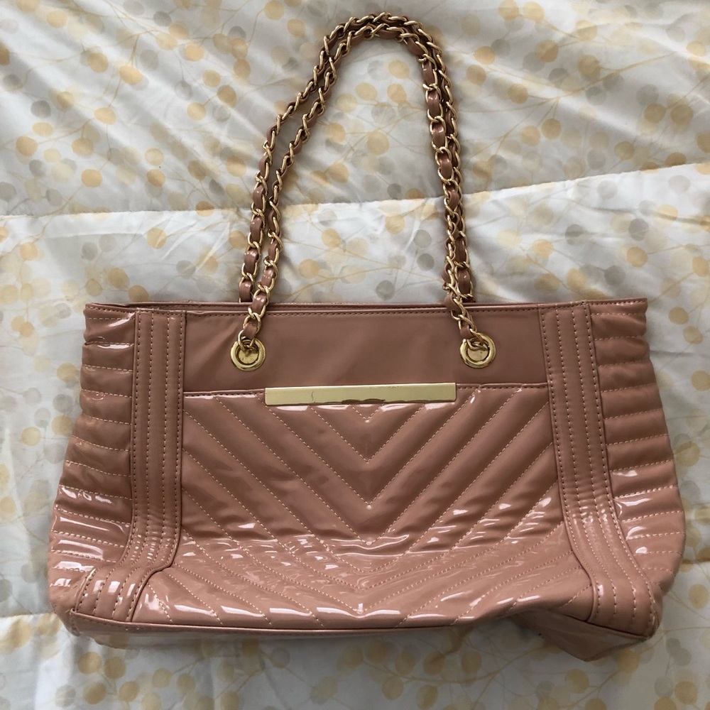 Light pink purse with gold accents